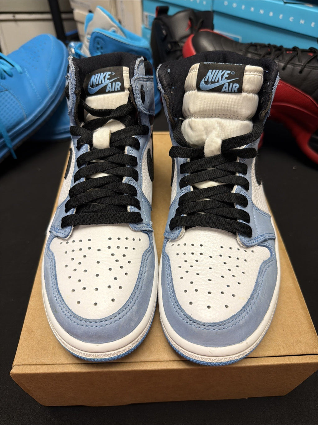 pair of Nike Air Jordan 1 Retro High OG sneakers in the "University Blue 6.5y
