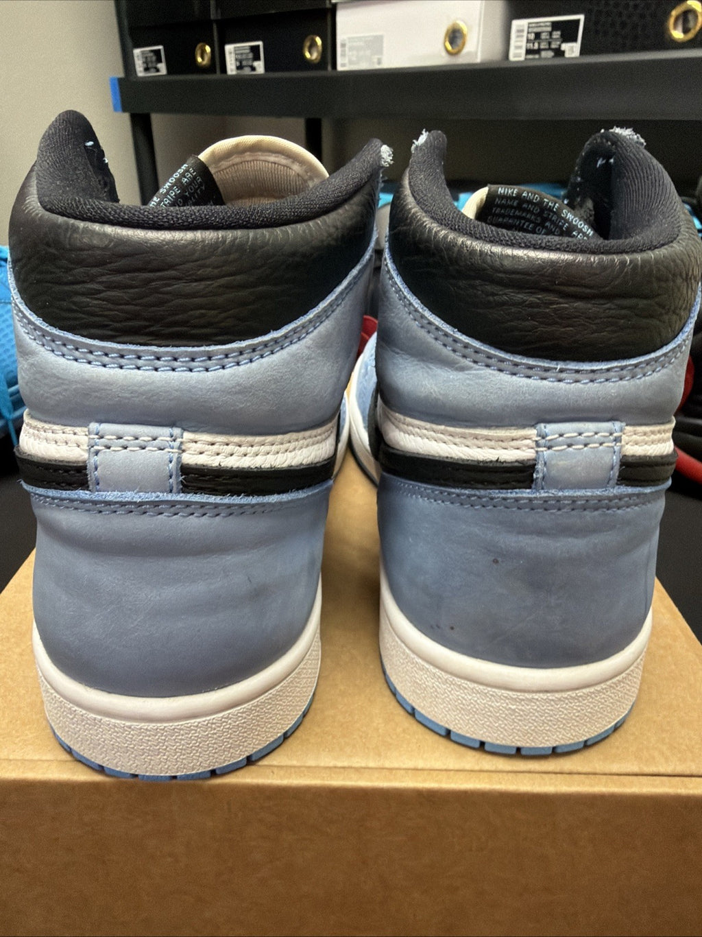 pair of Nike Air Jordan 1 Retro High OG sneakers in the "University Blue 6.5y