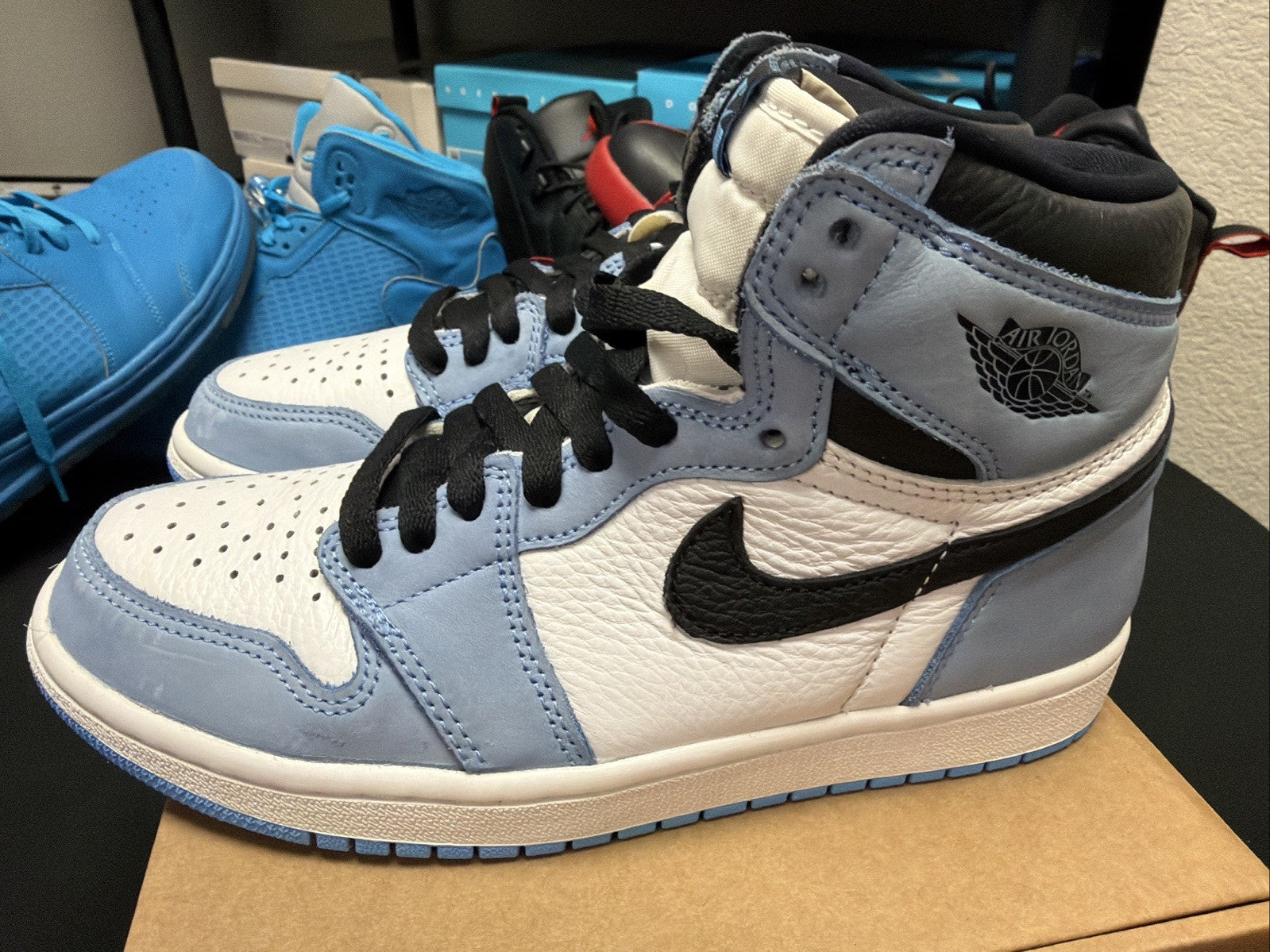pair of Nike Air Jordan 1 Retro High OG sneakers in the "University Blue 6.5y